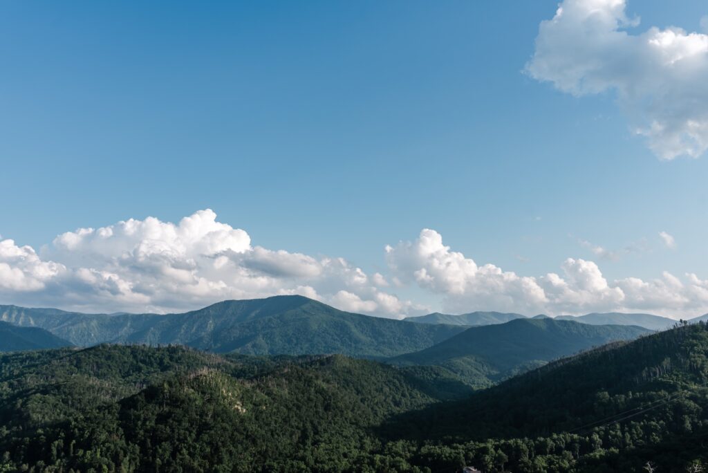 Smoky mountains on a sunny day with white clouds in the sky