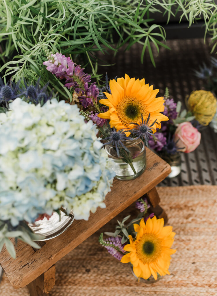 A proposal site set up with flowers in vases