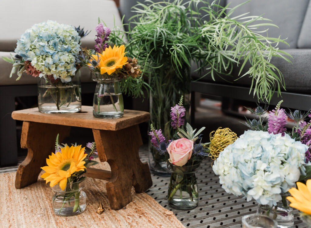 A proposal site set up with flowers in vases