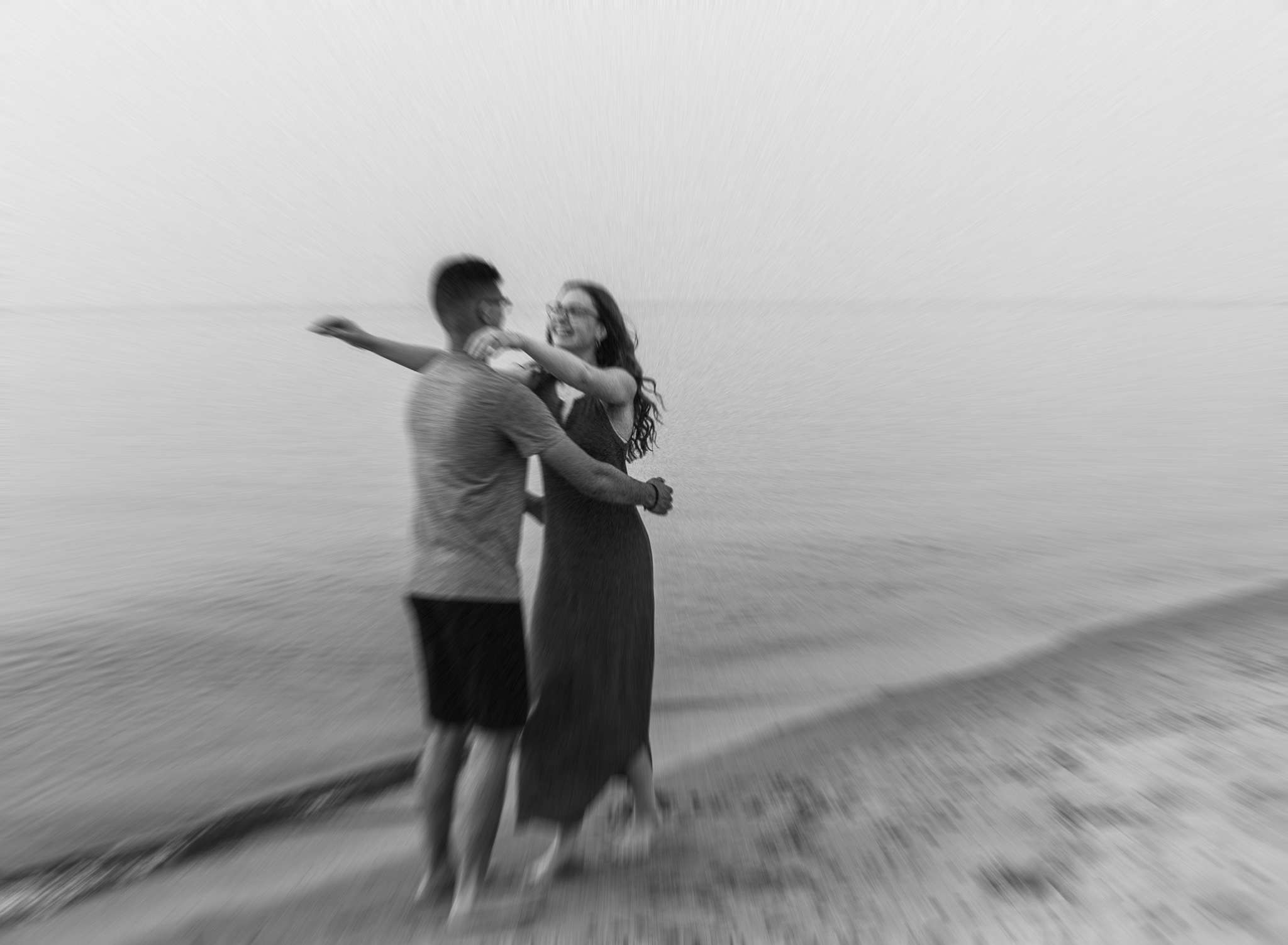 A runs into each others arms during their adventure session at Indiana Dunes National Park on Lake Michigan