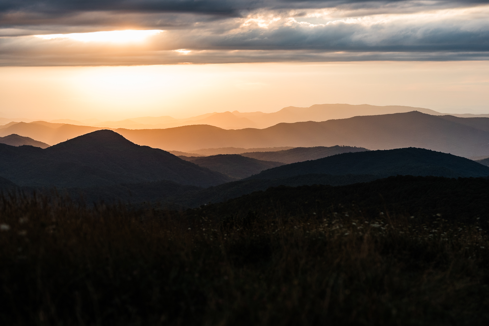 Rolling mountains as seen from Max Patch Trail at sunset.