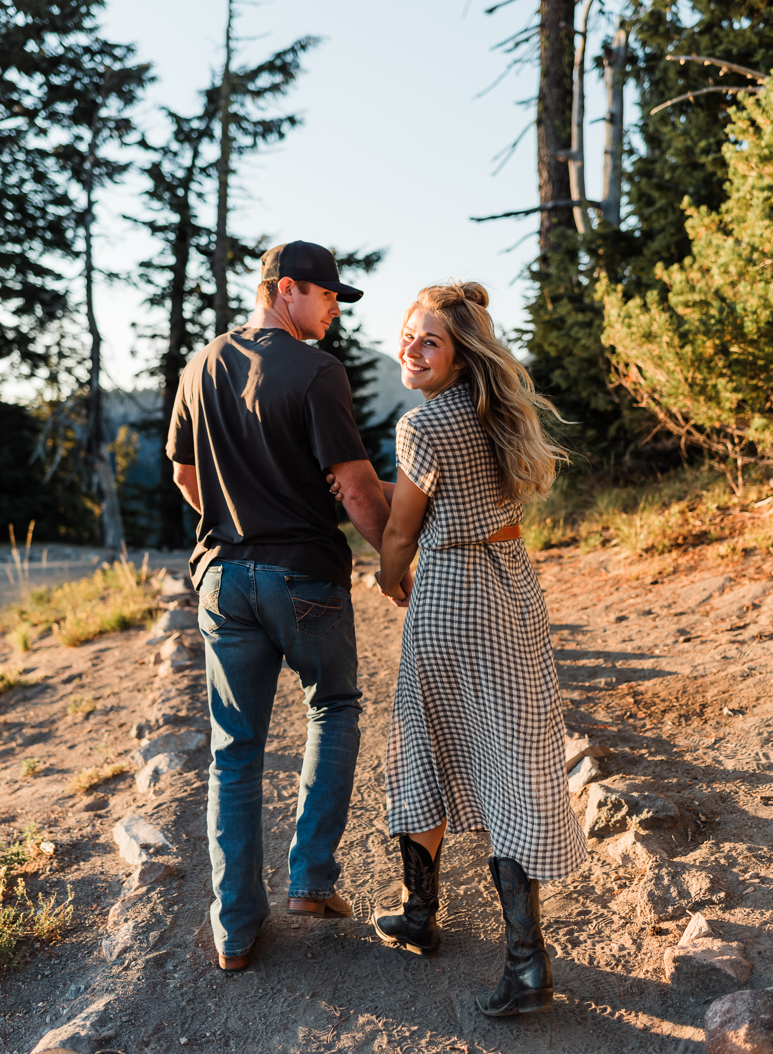 A couple walking on a trail together. 