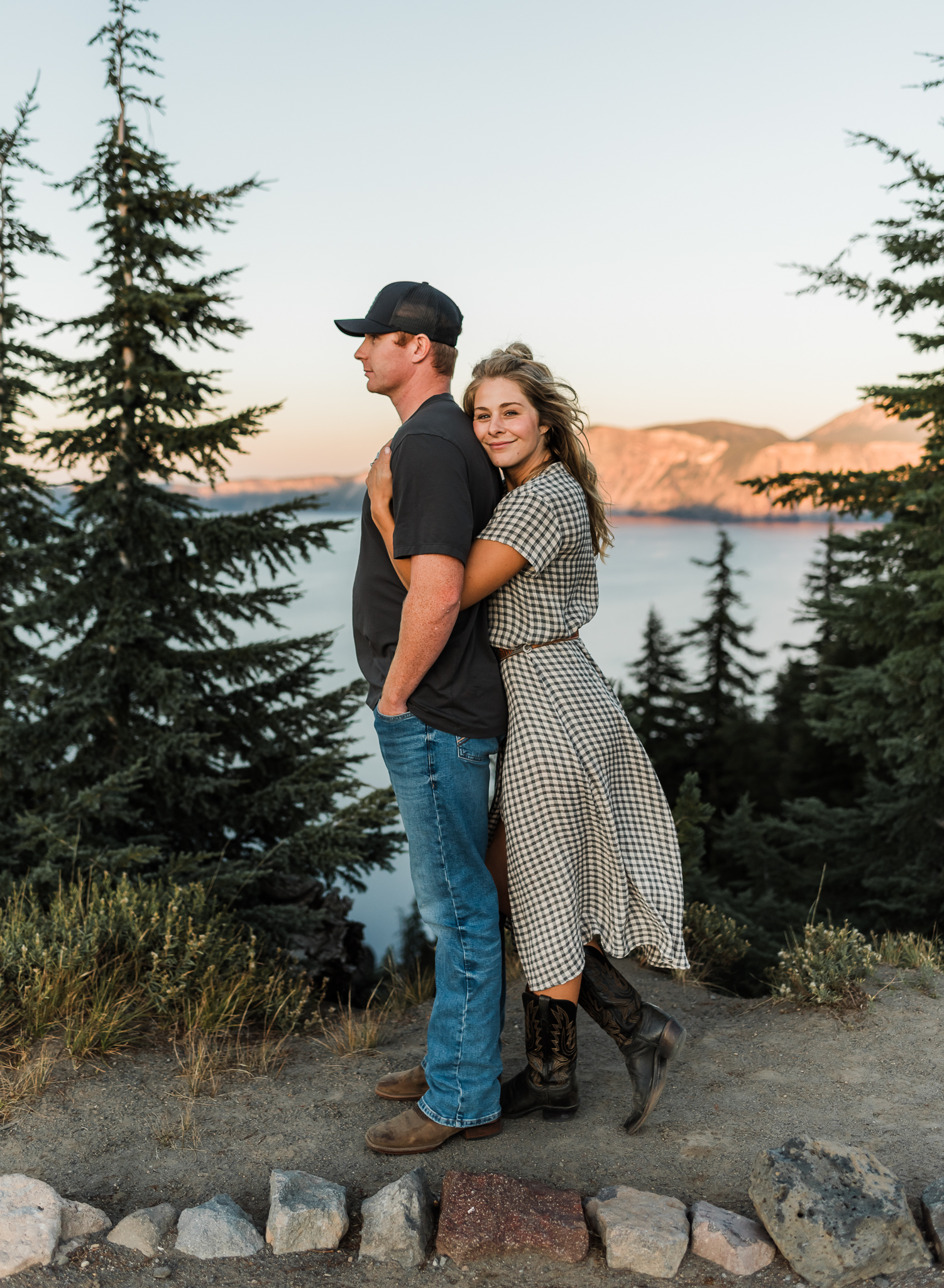 A couple standing together at an overlook 