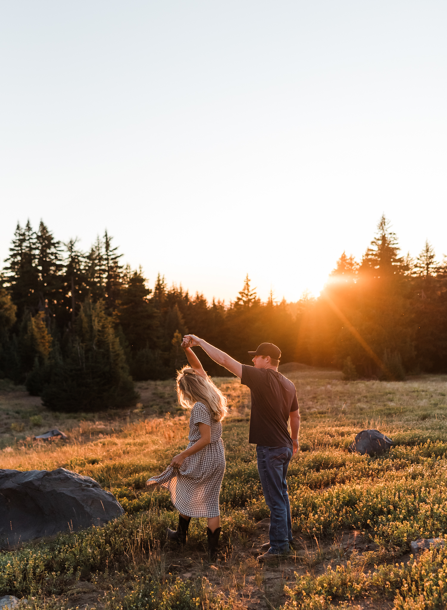 A couple dancing in a field at Crater Lake National Park.